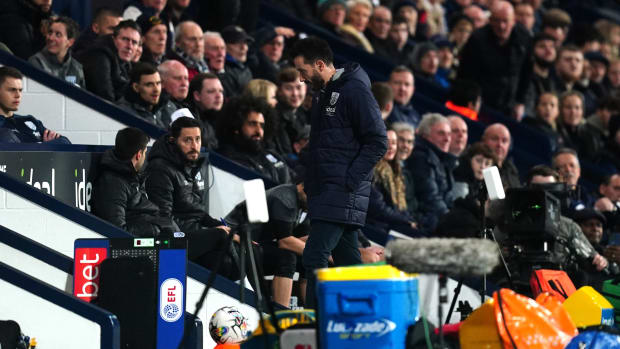 West Bromwich Albion manager Carlos Corberan pictured (center) walking towards the tunnel at The Hawthorns after being sent off during a game against Southampton in February 2024
