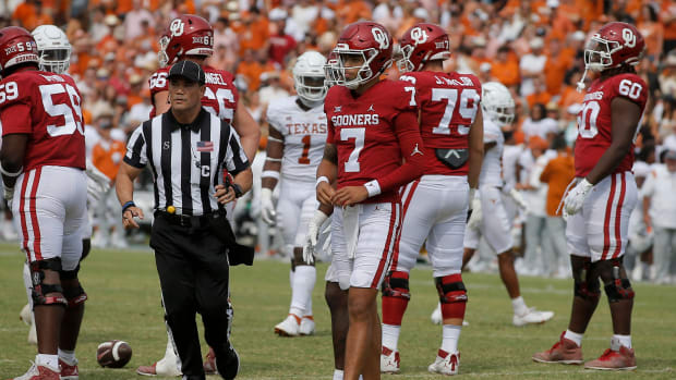 Oklahoma quarterback Nick Evers looking to the sideline for a playcall.