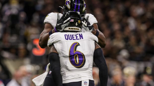 Patrick Queen celebrates with a Ravens teammate.