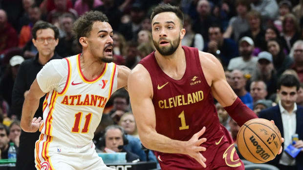 Dec 16, 2023; Cleveland, Ohio, USA; Cleveland Cavaliers guard Max Strus (1) drives to the basket against Atlanta Hawks guard Trae Young (11) during the second half at Rocket Mortgage FieldHouse. Mandatory Credit: Ken Blaze-USA TODAY Sports