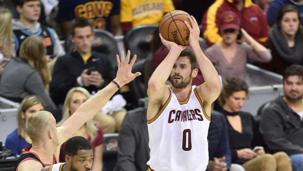 Nov 23, 2016; Cleveland, OH, USA; Cleveland Cavaliers forward Kevin Love (0) makes a three point basket in the first quarter against the Portland Trail Blazers at Quicken Loans Arena. Mandatory Credit: David Richard-USA TODAY Sports