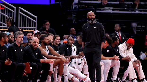 Brooklyn Nets head coach Jacque Vaughn watches the action from the bench against the Houston Rockets during the second quarter at Toyota Center.