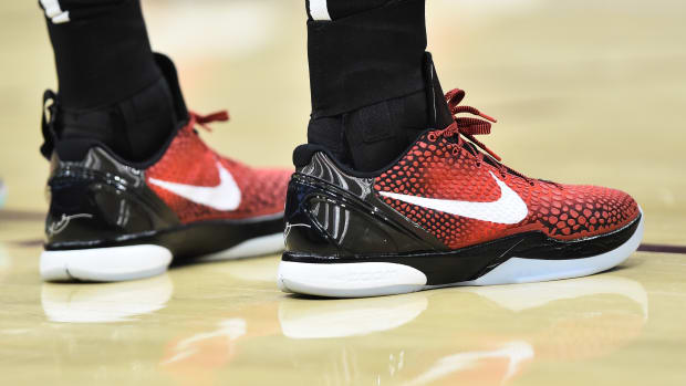 Red and black Nike Kobe 6 shoes.