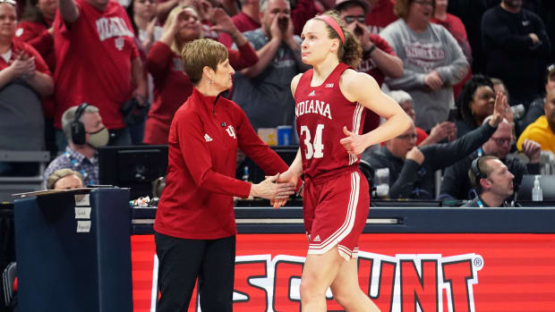 Grace Berger receives a high-five from Indiana head coach Teri Moren.