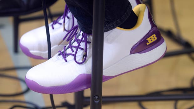 General view of white and purple shoes worn by Los Angeles Lakers player Lonzo Ball.
