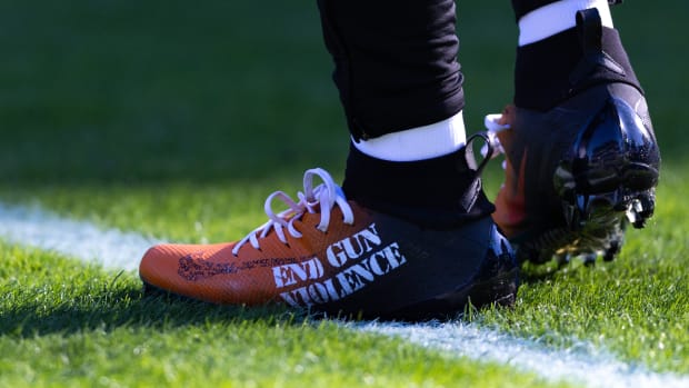 View of black and orange cleats.