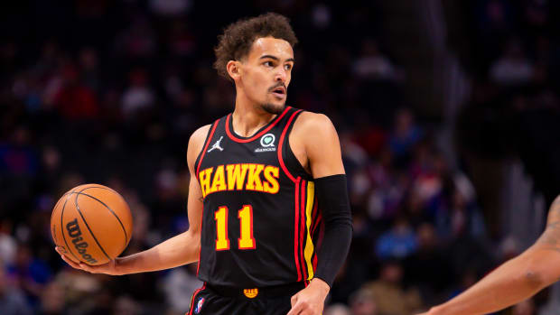 Mar 7, 2022; Detroit, Michigan, USA; Atlanta Hawks guard Trae Young (11) looks for an open man during the first quarter against the Detroit Pistons at Little Caesars Arena.