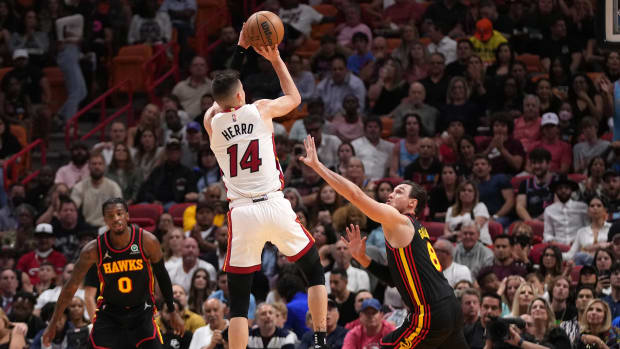 Apr 8, 2022; Miami, Florida, USA; Miami Heat guard Tyler Herro (14) shoots over Atlanta Hawks forward Danilo Gallinari (8) during the first half at FTX Arena.
