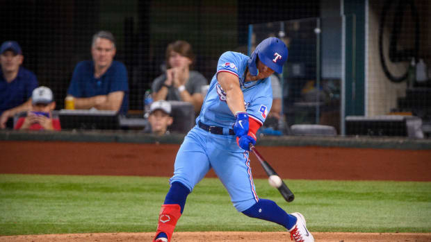 Jun 5, 2022; Arlington, Texas, USA; Texas Rangers left fielder Steele Walker (40) bats against the Seattle Mariners during the fifth inning at Globe Life Field. Mandatory Credit: Jerome Miron-USA TODAY Sports