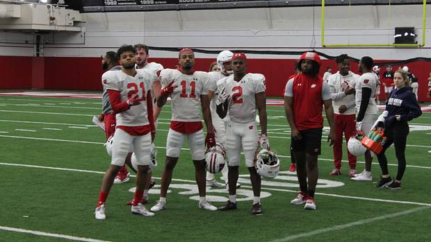 The Wisconsin cornerbacks posing for a picture during a break time.