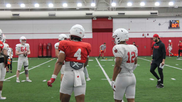 Markus Alen and Max Lofy talking after a special team's rep in spring practice.