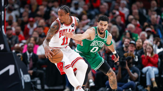 Chicago Bulls forward DeMar DeRozan is defended by Boston Celtics forward Jayson Tatum.