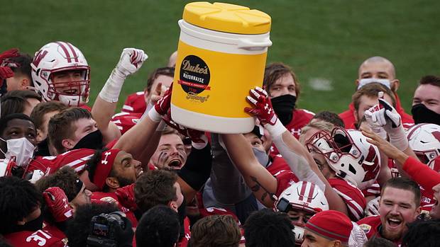 The Wisconsin Badgers celebrate a Duke's Mayo Bowl win.