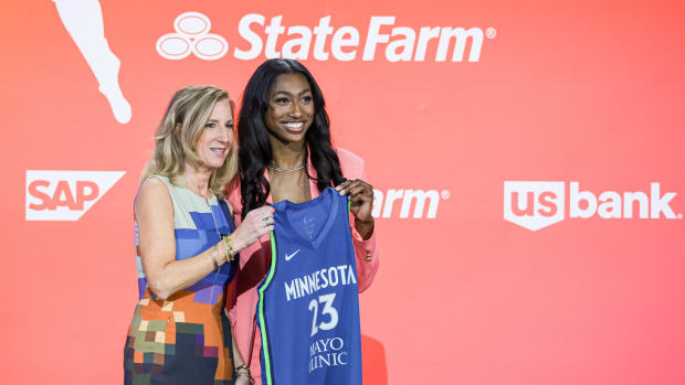 WNBA Commissioner Cathy Engelbert poses with Diamond Miller poses for a photo.