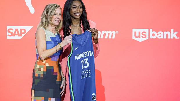 WNBA Commissioner Cathy Engelbert poses with Diamond Miller poses for a photo.