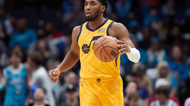 Donovan Mitchell dribbles the ball.