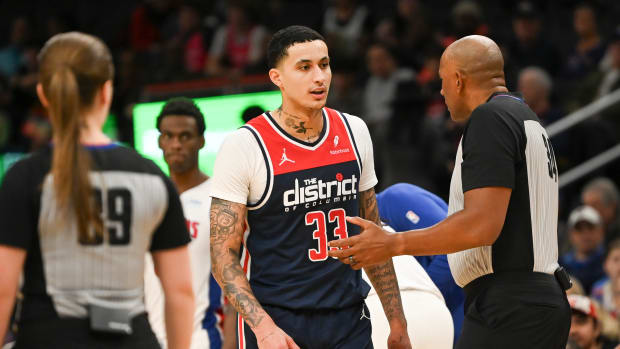 Washington Wizards forward Kyle Kuzma (33) speaks with referee Kevin Cutler (34) after being ejected during the second half against the Detroit Piston at Capital One Arena. Mandatory Credit: Tommy Gilligan-USA TODAY Sports