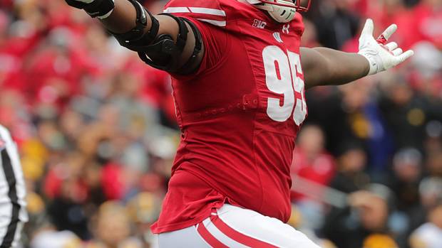Wisconsin defensive lineman Keeanu Benton celebrates a fumble recovery.