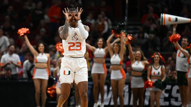 Mar 25, 2022; Chicago, IL, USA; Miami (Fl) Hurricanes guard Kameron McGusty (23) reacts after a three point basket during the first half against the Iowa State Cyclones in the semifinals of the Midwest regional of the men's college basketball NCAA Tournament at United Center.