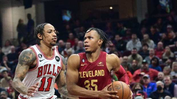 Jan 2, 2023; Cleveland, Ohio, USA; Cleveland Cavaliers forward Isaac Okoro (35) drives to the basket against Chicago Bulls forward DeMar DeRozan (11) during the first half at Rocket Mortgage FieldHouse.