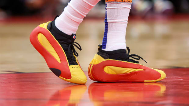 Los Angeles Clippers guard James Harden's red and gold adidas sneakers.