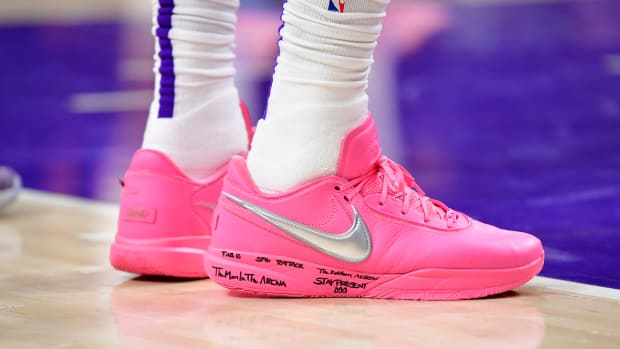 View of LeBron James' pink and silver Nike shoes.
