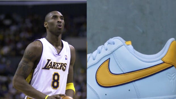 Los Angeles Lakers guard Kobe Bryant with a white Nike sneaker.
