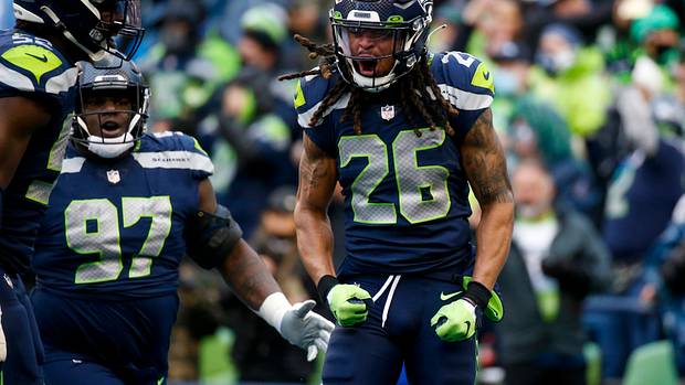 Seattle Seahawks defensive back Ryan Neal (26) celebrates following a play against the Detroit Lions during the second quarter at Lumen Field.