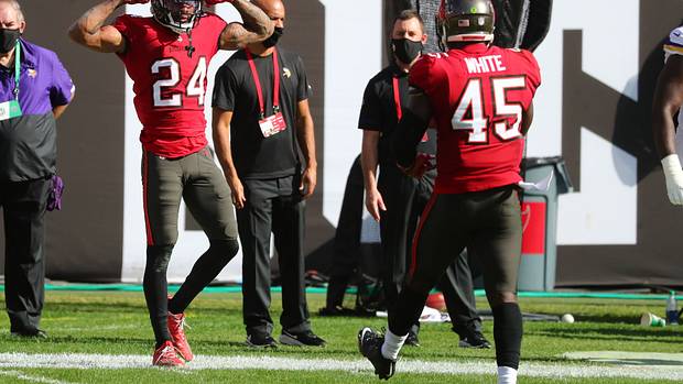Tampa Bay Buccaneers cornerback Carlton Davis III (left) and linebacker Devin White (right) celebrate a play.