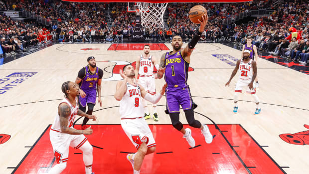 Mar 29, 2023; Chicago, Illinois, USA; Los Angeles Lakers guard D'Angelo Russell (1) goes to the basket against the Chicago Bulls during the first half at United Center.