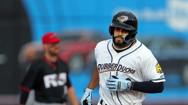 Akron RubberDucks left fielder Jonathan Rodriguez, right, rounds the bases after hitting a two-run homer to right center field against the Richmond Flying Squirrels during the first inning of a Minor League Baseball game at Canal Park, Thursday, July 20, 2023, in Akron, Ohio.