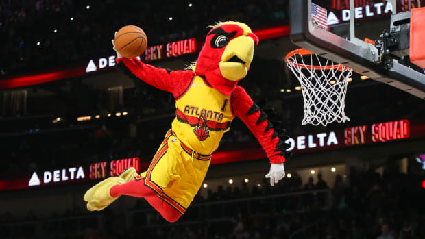 Atlanta Hawks mascot dunks during a timeout.