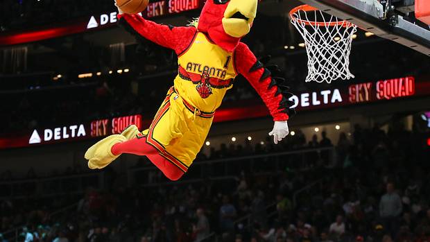 Atlanta Hawks mascot dunks during a timeout.