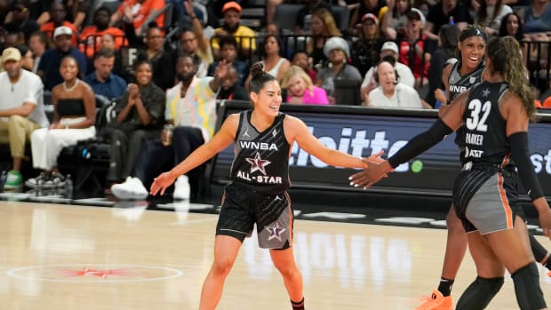 Kelsey Plum celebrates during the 2023 WNBA All-Star Game.