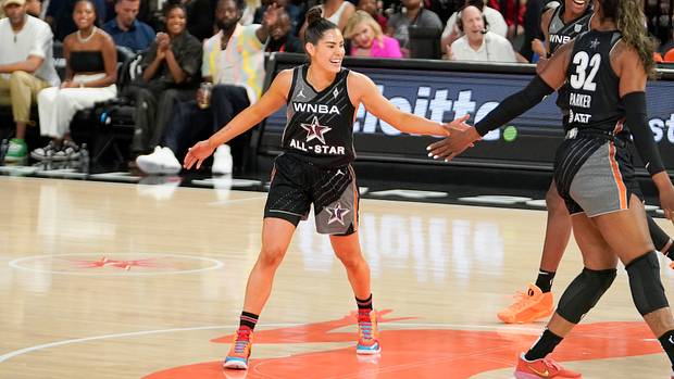 Kelsey Plum celebrates during the 2023 WNBA All-Star Game.