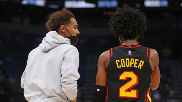 Atlanta Hawks guard Trae Young (left) talks with guard Sharife Cooper (2) during the second half against the Memphis Grizzlies at FedExForum.