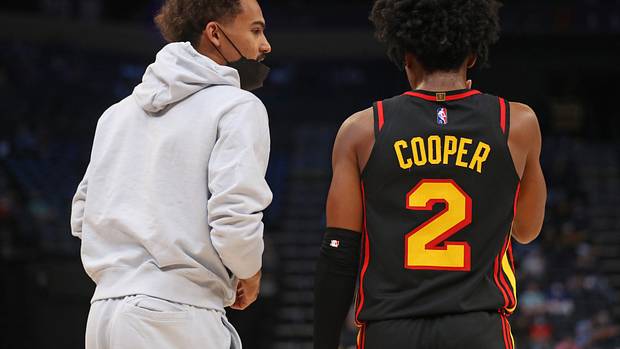 Atlanta Hawks guard Trae Young (left) talks with guard Sharife Cooper (2) during the second half against the Memphis Grizzlies at FedExForum.