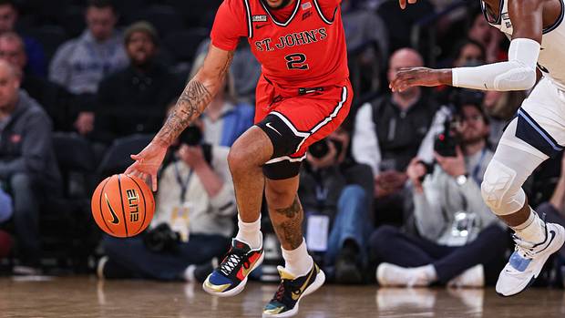 St. John's Red Storm guard Julian Champagnie (2) dribbles up court against Villanova Wildcats forward Brandon Slater (3) during the first half at Madison Square Garden.