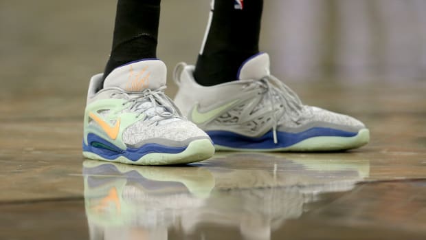View of Kevin Durant's grey and green Nike shoes.