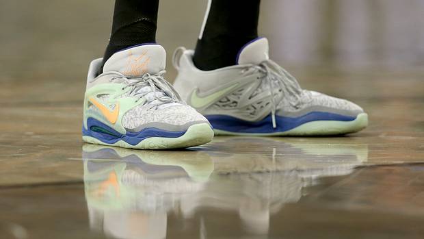 View of Kevin Durant's grey and green Nike shoes.