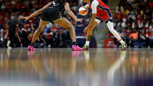 New York Liberty forward Betnijah Laney defends Washington Mystics guard Natasha Cloud.