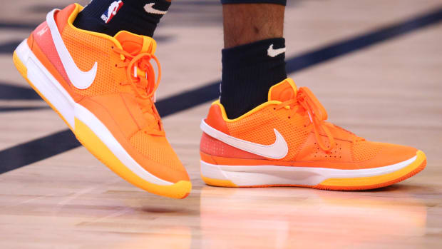 Memphis Grizzlies guard Ja Morant's orange and white Nike sneakers.