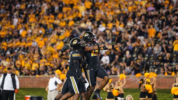 Missouri Tigers defensive back Daylan Carnell (13) celebrates with defensive back Martez Manuel (3) and linebacker Ty'Ron Hopper (8) after a play against the Louisiana Tech Bulldogs