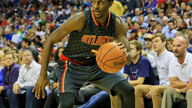 Atlanta Hawks guard Justin Holiday (7) against the New Orleans Pelicans during a game at the Smoothie King Center. The Hawks defeated the Pelicans 121-115.