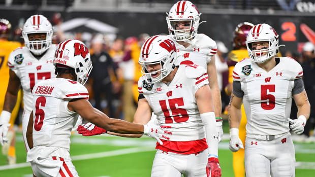 Wisconsin safety John Torchio celebrating in the Las Vegas Bowl after an interception (Credit: Stephen R. Sylvanie-USA TODAY Sports)