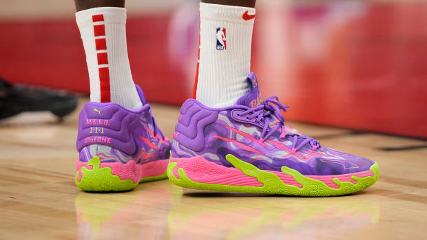 LaMelo Ball's purple and green PUMA sneakers.