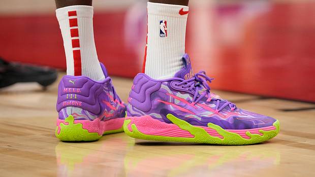 LaMelo Ball's purple and green PUMA sneakers.