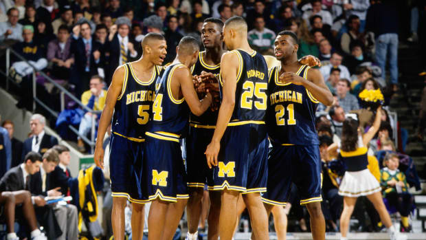 The 1992 Michigan Wolverines basketball team during a timeout.