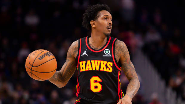Mar 7, 2022; Detroit, Michigan, USA; Atlanta Hawks guard Lou Williams (6) dribbles the ball during the second quarter against the Detroit Pistons at Little Caesars Arena.