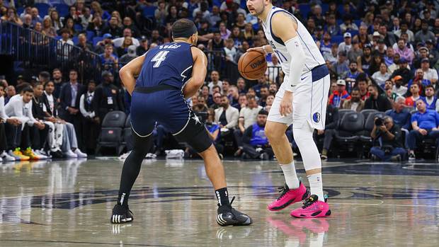 Dallas Mavericks superstar dribbling the ball against the Orlando Magic.